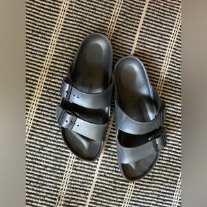 Birkenstock slides. Rubbery waterproof.
